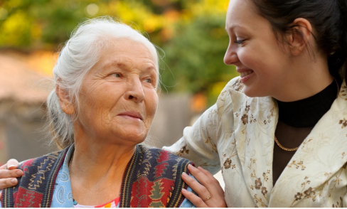 Grandmother and older granddaughter smiling